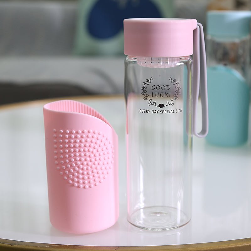 https://starcopia.com/cdn/shop/products/350ml-glass-water-bottle-with-silicone-sleeve-468512_1445x.jpg?v=1661502351